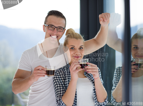 Image of young couple enjoying morning coffee