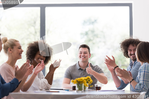 Image of multiethnic startup Group of young business people celebrating s