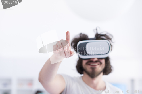 Image of man using VR-headset glasses of virtual reality