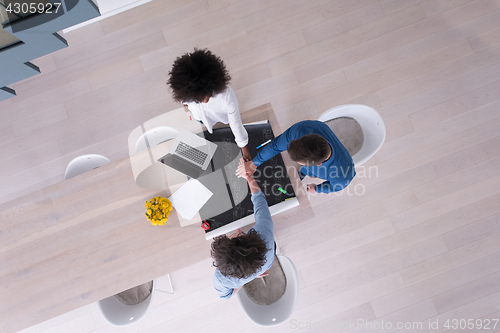 Image of top view of Multiethnic startup business team on meeting