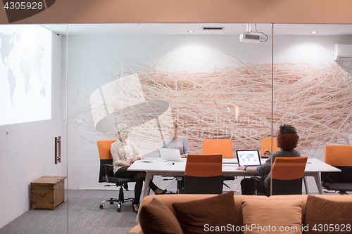 Image of Startup Business Team At A Meeting at modern night office buildi