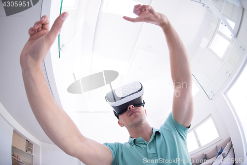 Image of man using VR-headset glasses of virtual reality