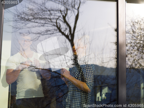 Image of young couple enjoying morning coffee