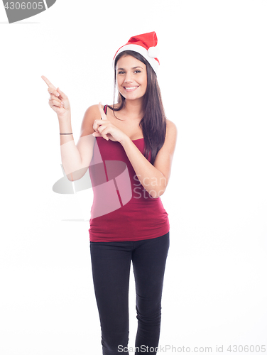 Image of Happy christmas woman pointing