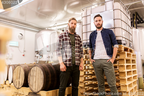 Image of men at craft brewery or beer plant