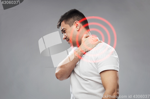 Image of unhappy man suffering from neck pain