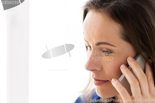 Image of close up of woman calling on smartphone