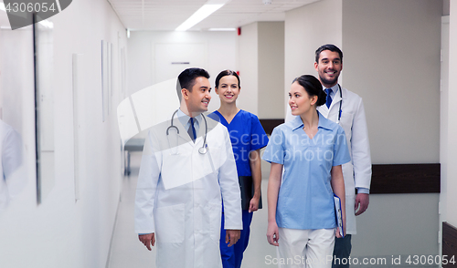 Image of group of happy medics or doctors at hospital