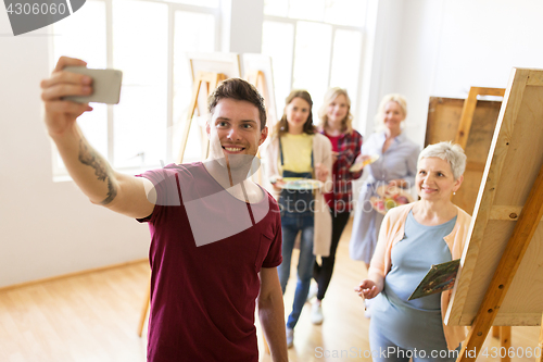 Image of group of artists taking selfie at art school