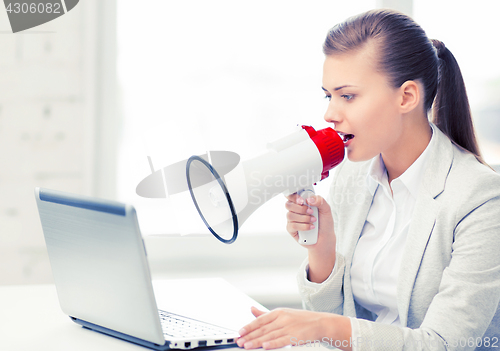 Image of strict businesswoman shouting in megaphone