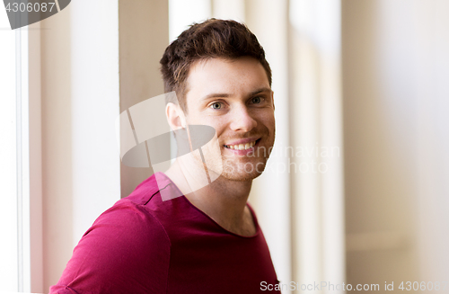 Image of portrait of happy smiling handsome young man