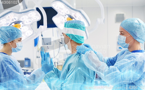 Image of surgeons in operating room at hospital