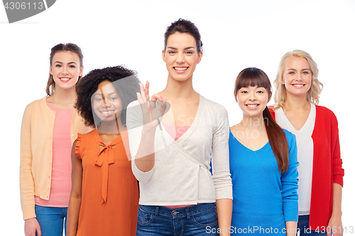 Image of international group of happy women showing ok