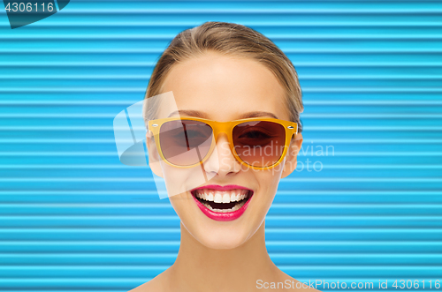 Image of happy teenage girl or woman face in shades