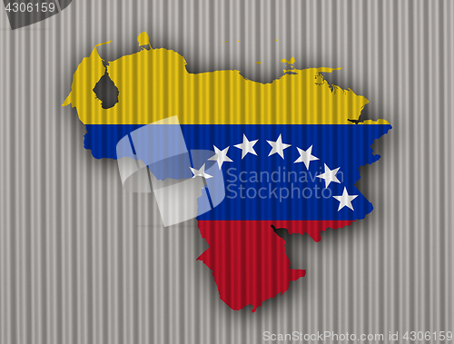 Image of Map and flag of Venezuela on corrugated iron