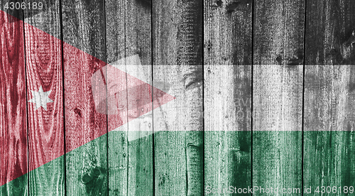 Image of Flag of Jordan on weathered wood