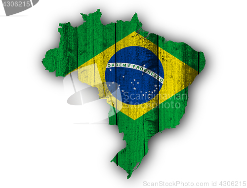 Image of Map and flag of Brazil on weathered wood