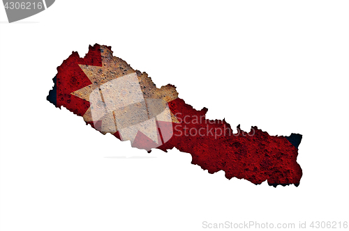 Image of Map and flag of Nepal on rusty metal