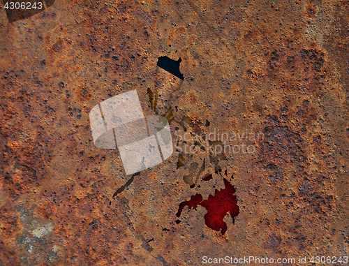 Image of Map and flag of the Philippines on rusty metal