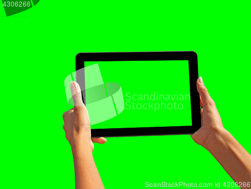 Image of Young girl hand holding a tablet on green screen