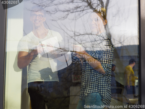 Image of young couple enjoying morning coffee