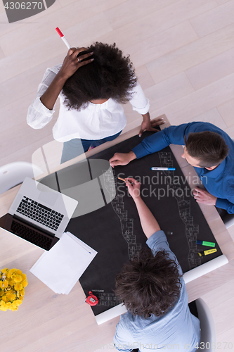 Image of top view of Multiethnic startup business team on meeting