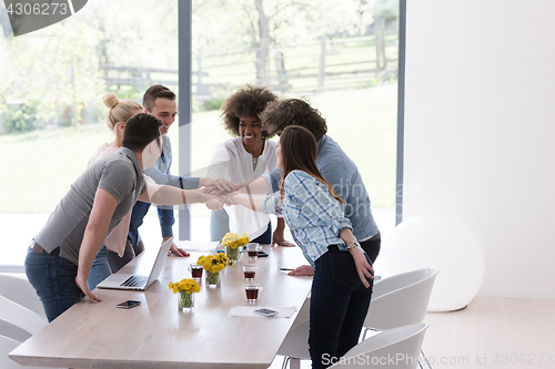 Image of multiethnic startup Group of young business people celebrating s