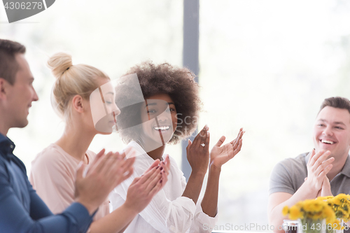 Image of multiethnic startup Group of young business people celebrating s