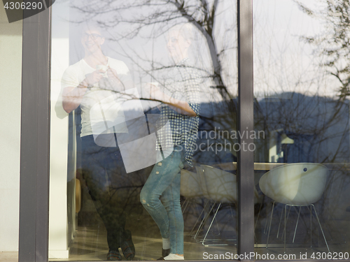 Image of young couple enjoying morning coffee