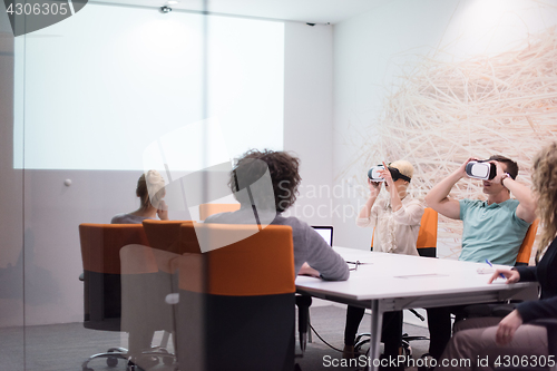 Image of startup business team using virtual reality headset