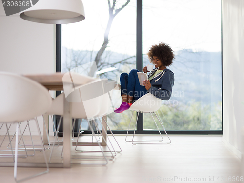 Image of young African American woman in the living room