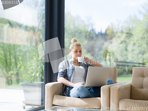 Image of woman drinking coffee enjoying relaxing lifestyle