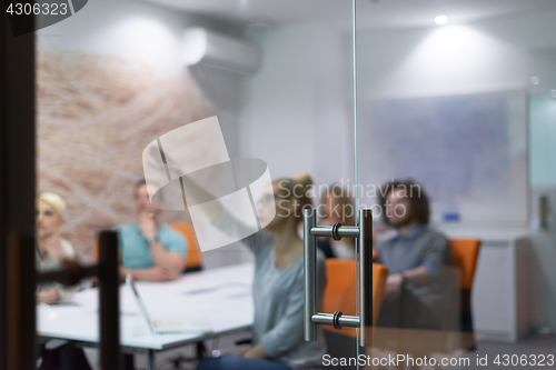 Image of Startup Business Team At A Meeting at modern night office buildi