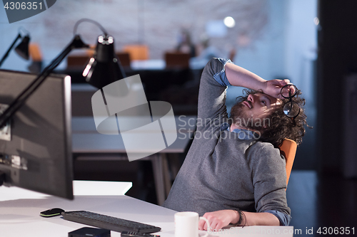 Image of businessman relaxing at the desk