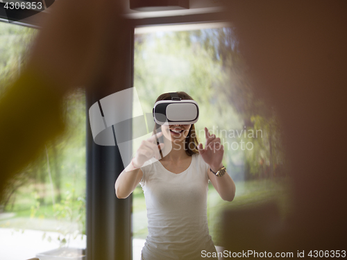 Image of woman using VR-headset glasses of virtual reality