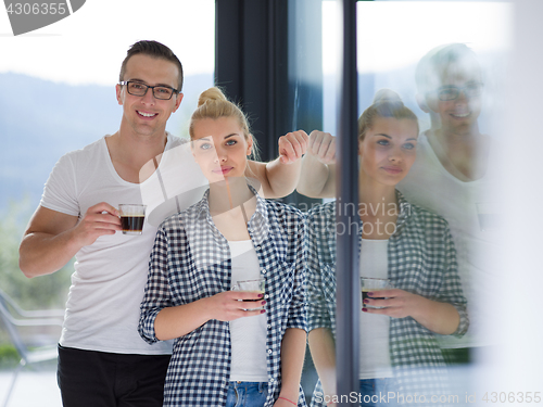 Image of young couple enjoying morning coffee