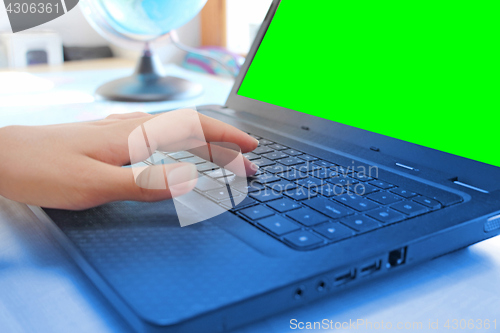 Image of Women hands working on laptop in office on green screen