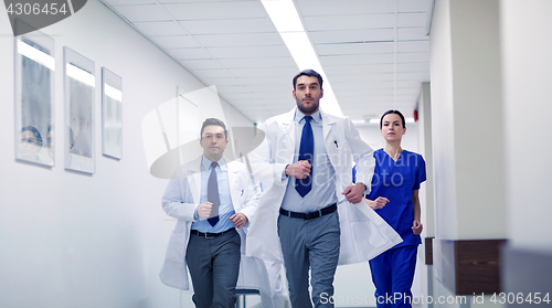 Image of group of medics walking along hospital