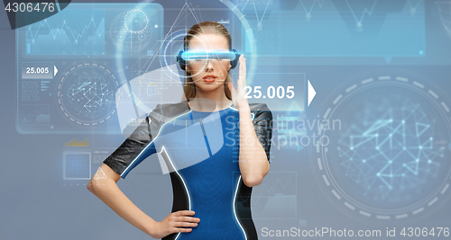 Image of woman in virtual reality 3d glasses with charts