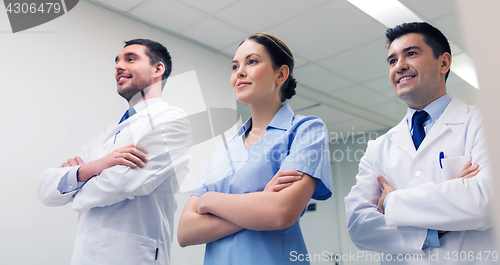 Image of group of happy medics or doctors at hospital