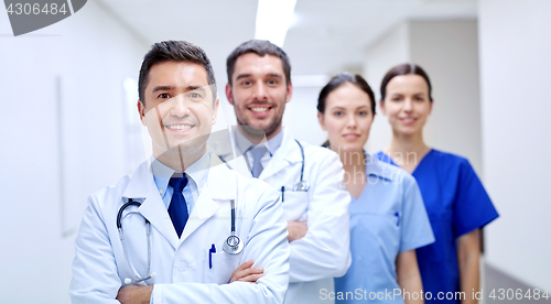 Image of group of happy medics or doctors at hospital