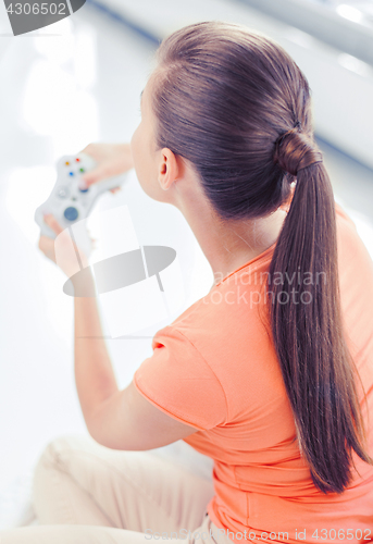 Image of woman with joystick playing video games