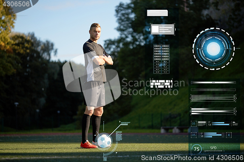 Image of soccer player with ball on football field