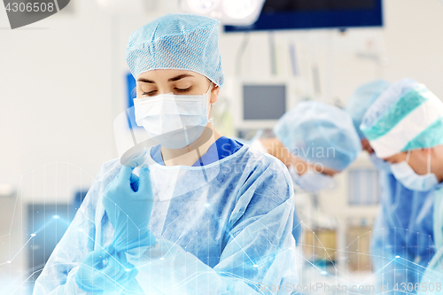 Image of surgeon in operating room at hospital