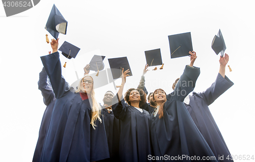 Image of happy students throwing mortar boards up