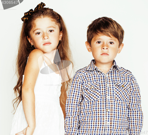 Image of little cute boy girl hugging playing on white background, happy family close up isolated. brother and sister smiling