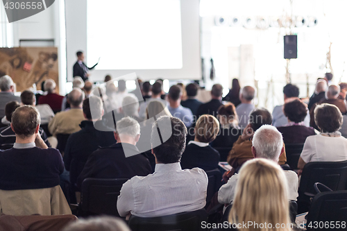 Image of Business speaker giving a talk at business conference event.