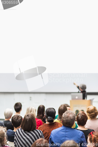 Image of Woman giving presentation on business conference.