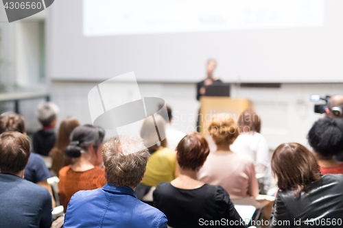 Image of Woman giving presentation on business conference.