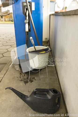 Image of Bucket with water on gas station